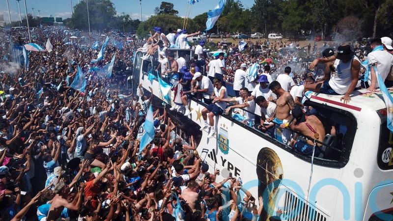 Argentina’s World Cup winners abandon parade as millions flock on to streets