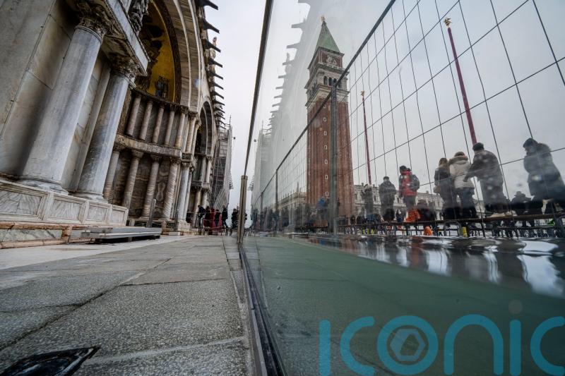Glass barriers help protect Venice’s famous basilica from high tides