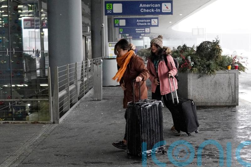 Holiday travel upended in the US as forecasters warn of ‘bomb cyclone’
