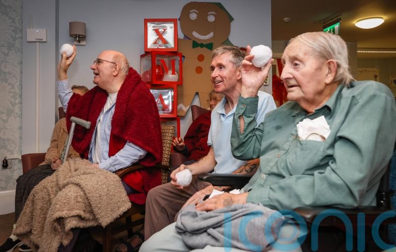 Indoor snowball fight at care home enjoying first restriction-free Christmas
