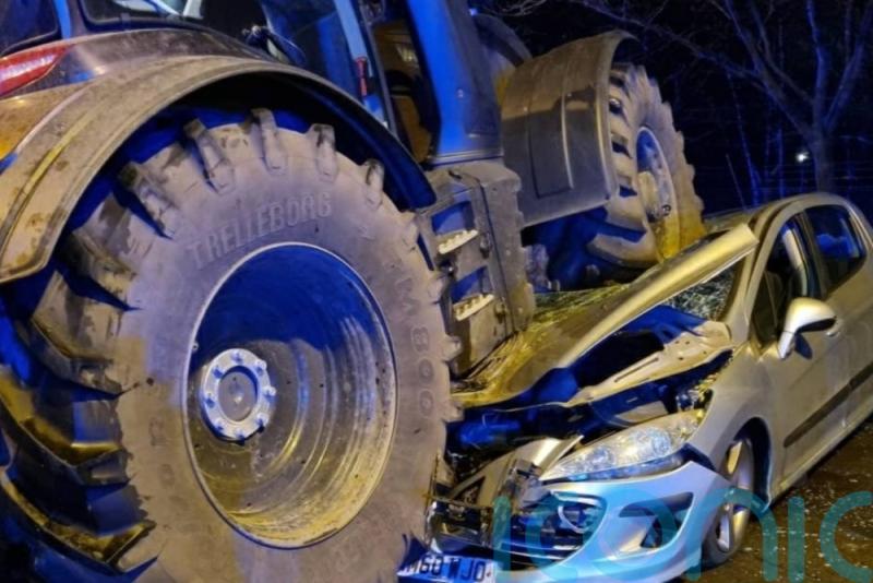 Three people taken to hospital after car crushed under tractor