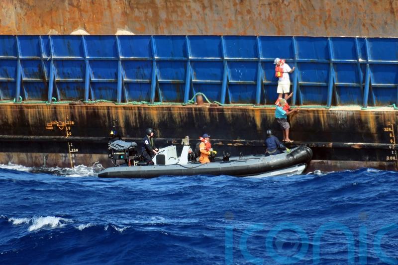 Warship rescues crew of sinking tug in the Caribbean
