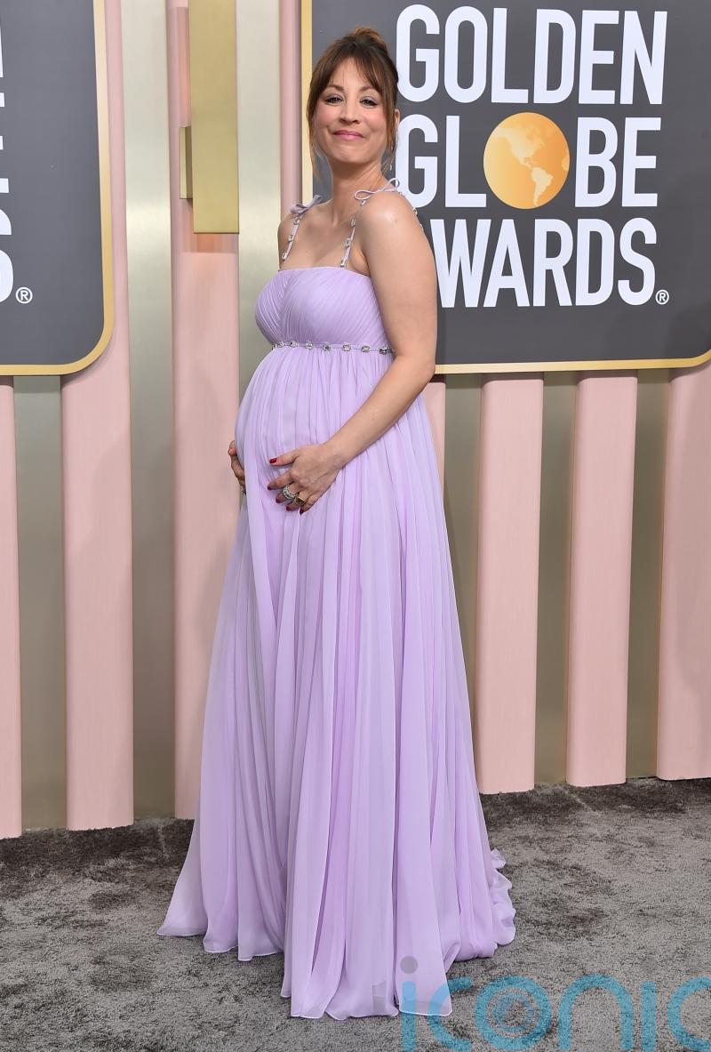 Kaley Cuoco debuts growing baby bump on Golden Globes red carpet