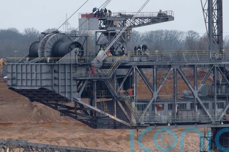 Climate activists occupy giant digger at German coal mine