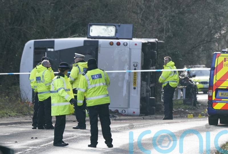Double-decker bus overturns in crash with motorcycle