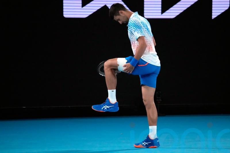 Djokovic taking hamstring injury ‘day to day’ as he progresses in Melbourne