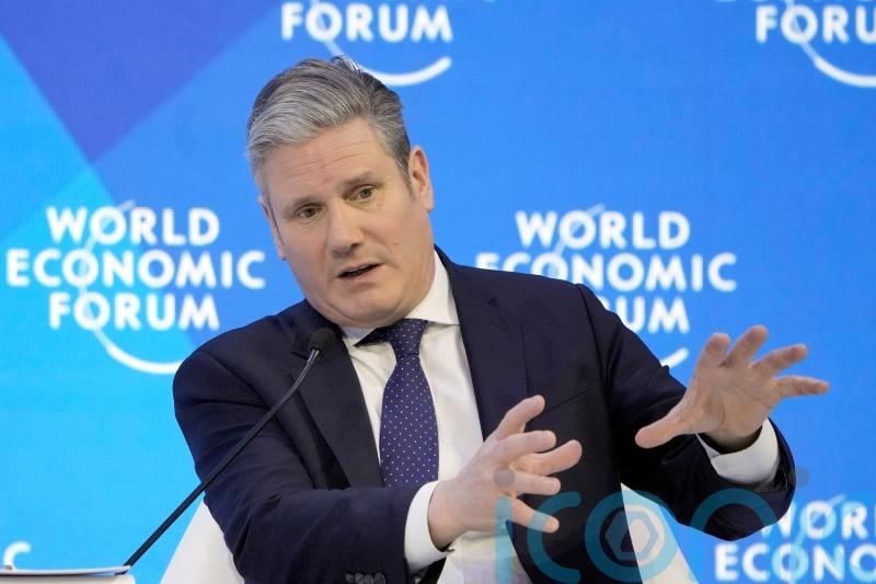Starmer calls for ‘clean power alliance’ at Davos and criticises Sunak’s absence