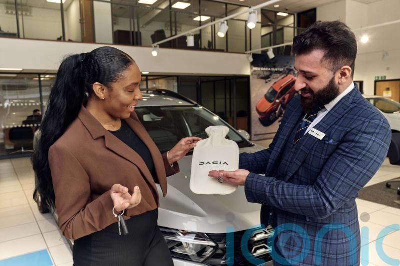 Dacia pokes fun at other car firms with its subscription-free hot water bottles