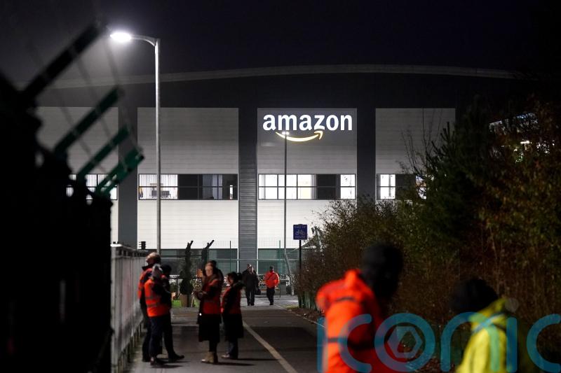 Amazon workers walk out in UK first for company&rsquo;s staff in pay dispute