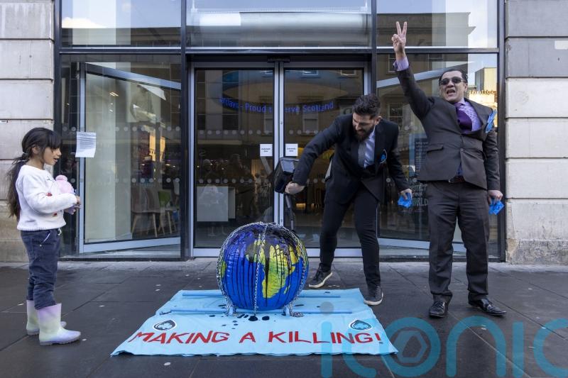 Climate activists protest outside Barclays offices in Glasgow