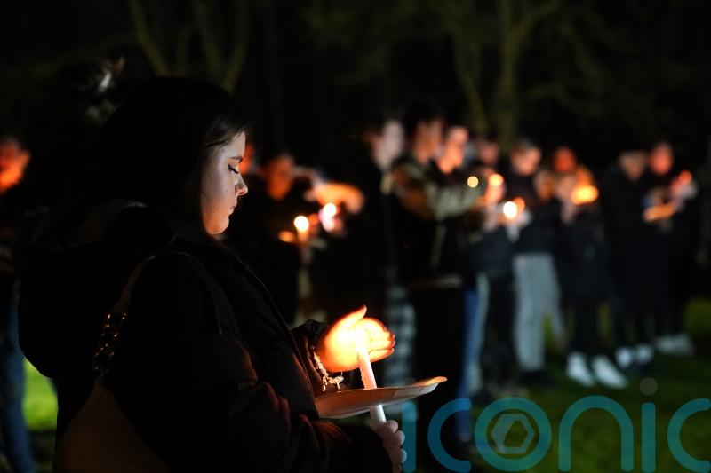Candlelit vigil held for girl, four, who was mauled to death by pet dog