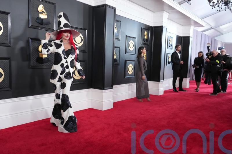 Shania Twain graces Grammys red carpet in cow-print inspired suit and hat
