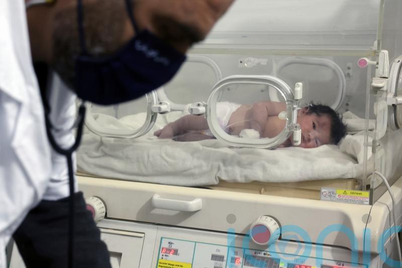 Newborn baby rescued after mother gives birth while buried in quake debris
