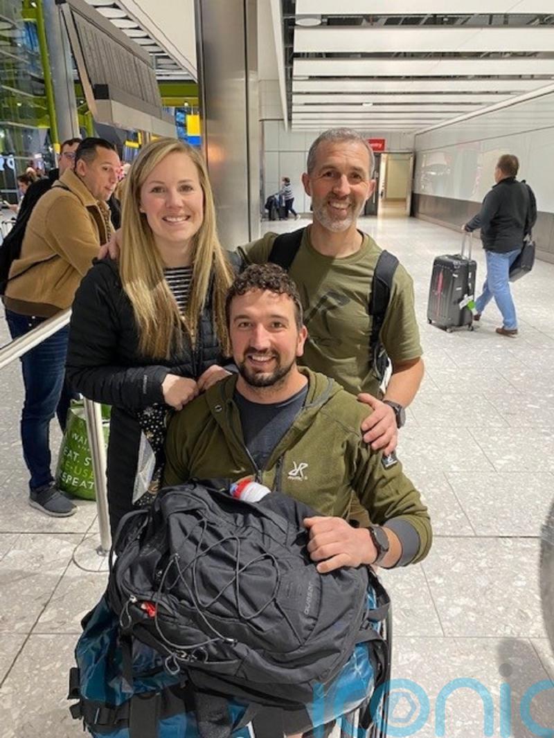 Athlete who completed endurance challenge in wheelchair returns to UK