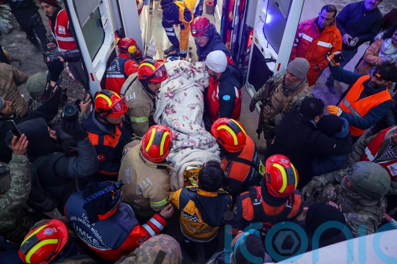 Rescuers find five members of single family alive in rubble days after quake