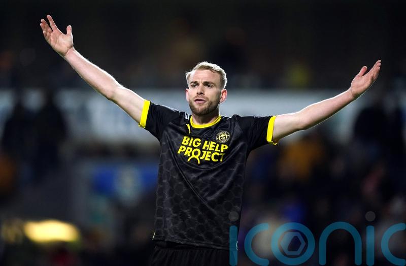 Wigan drag Huddersfield into drop zone as Jack Whatmough heads home winner
