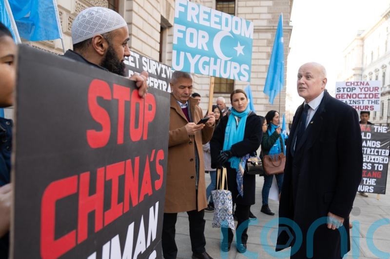 Sir Iain Duncan Smith joins protest by Uighur activists at FCDO