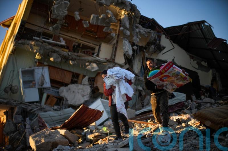 Rescuers pull more survivors from earthquake wreckage
