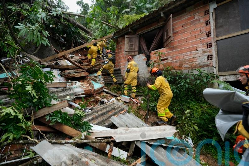 Search for survivors after landslides and flooding kill 36 in Brazil