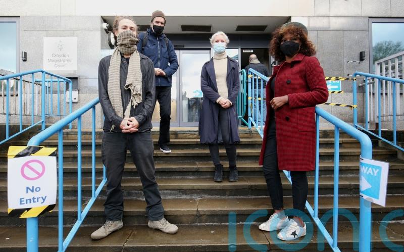 Extinction Rebellion co-founder cleared of one charge over paint-throwing stunt