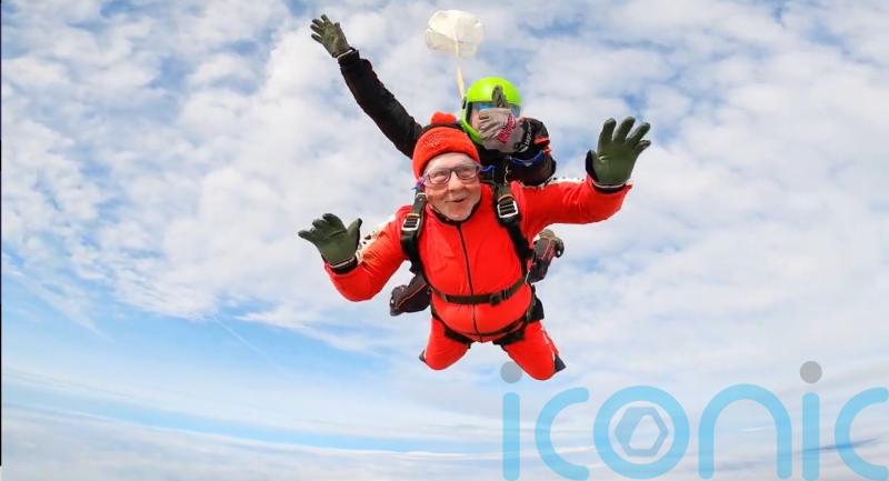 Man, 76, with prostate cancer completes 11,000ft skydive in memory of partner