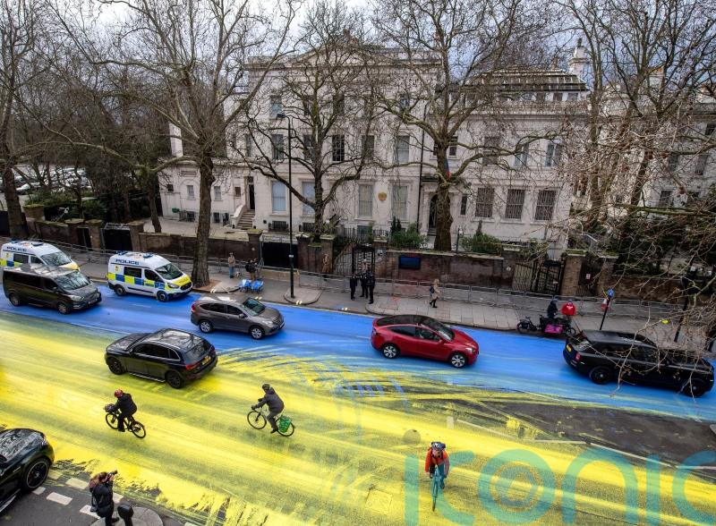 Four arrests after campaigners paint Ukrainian flag outside Russian embassy