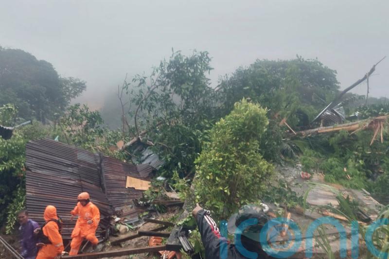 Rescuers search for dozens buried in Indonesian landslides