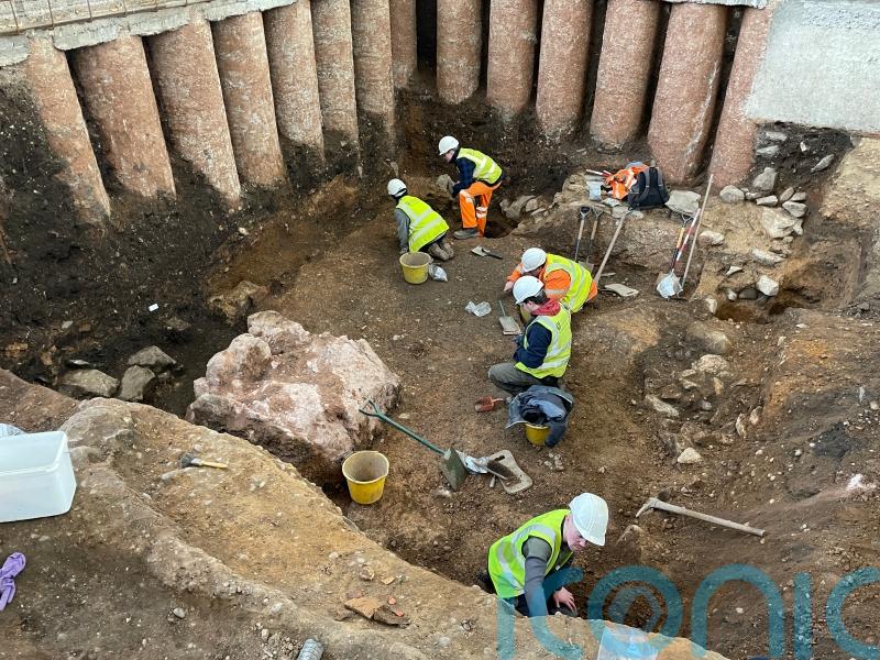 Evidence of Roman shrine uncovered during archaeological dig in graveyard
