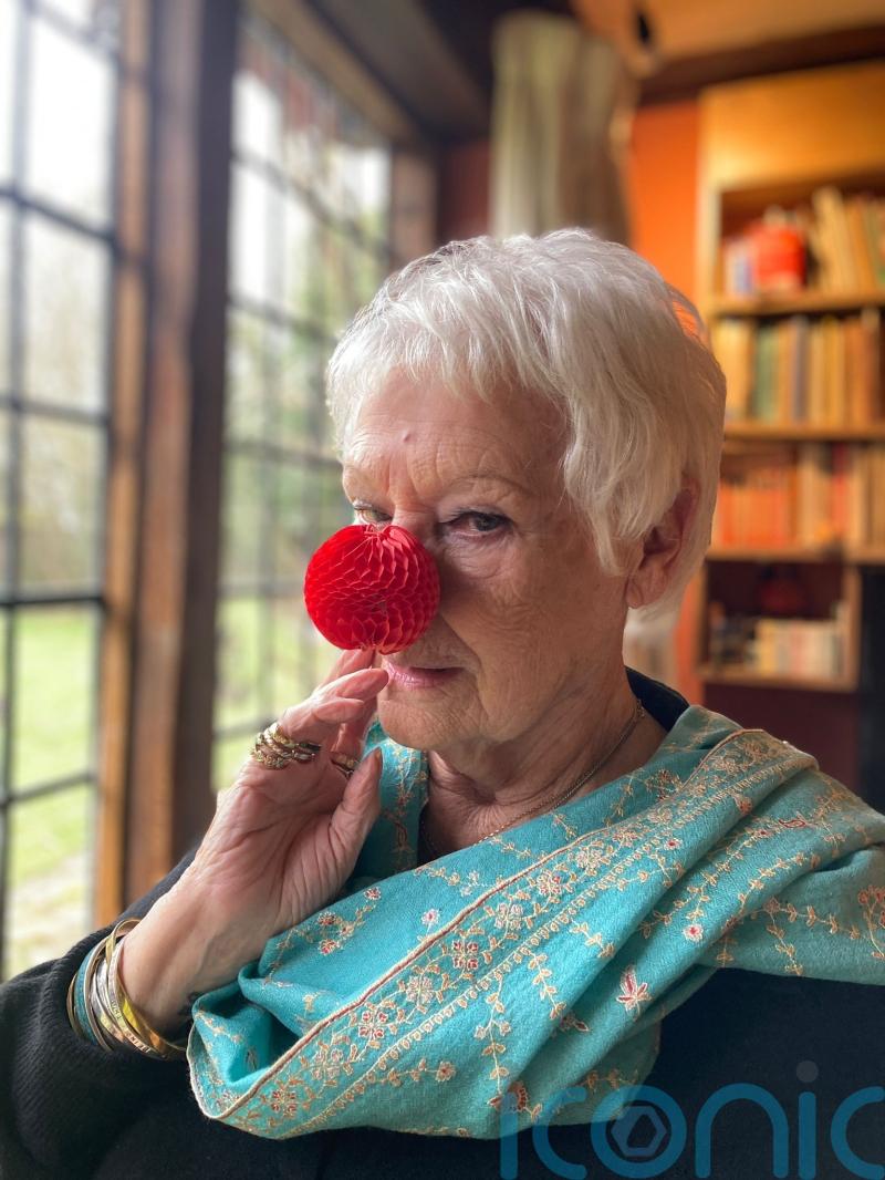 Dame Judi Dench dons ‘very clever’ red nose for Comic Relief