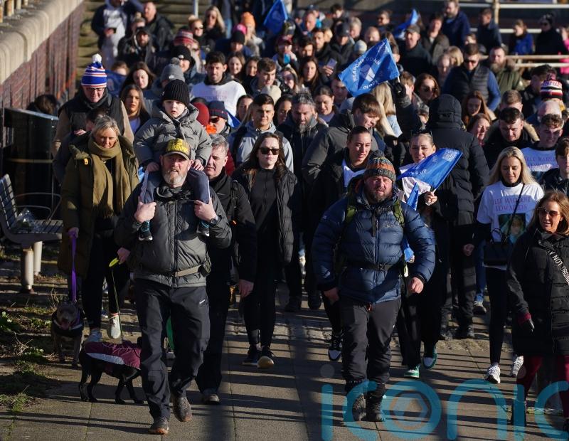 Hundreds join shooting victim’s father for walk against gun and knife crime