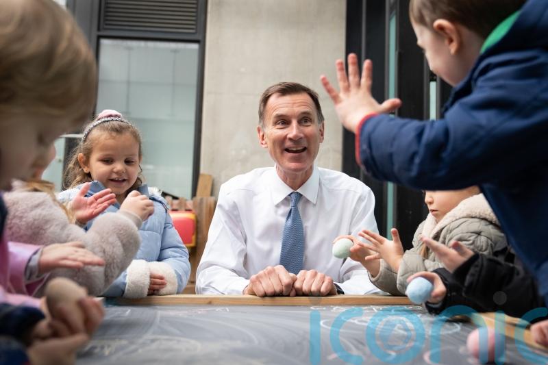 Hunt spends Budget windfall on childcare and tax breaks for wealthy pensioners