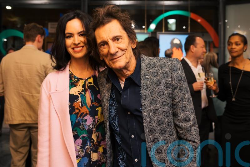 The Rolling Stones star Ronnie Wood joins family at exhibition opening in London