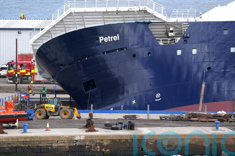 Emergency services at scene after ship topples in dry dock