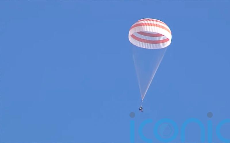 Russian space capsule hit by coolant leak returns safely to Earth