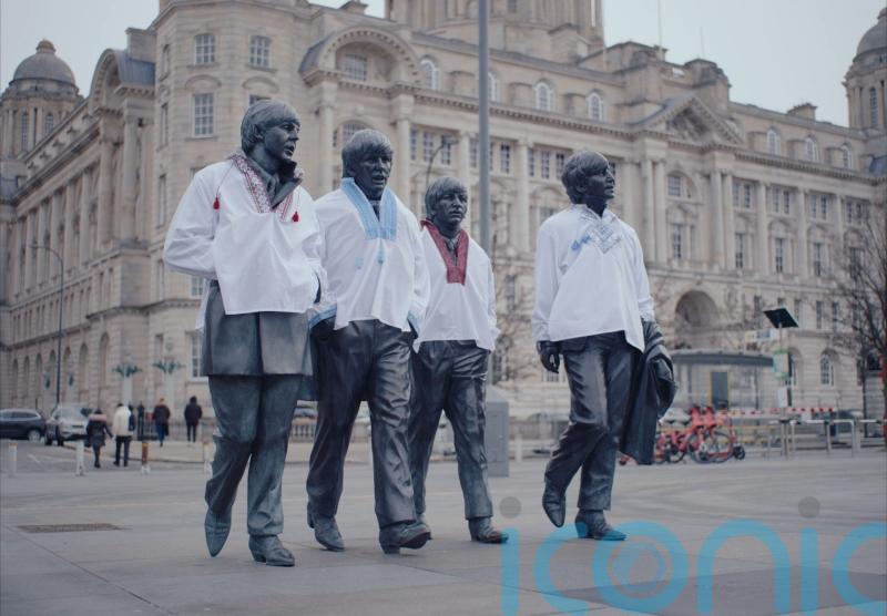 The Beatles Statue dressed in Ukrainian clothing ahead of Eurovision