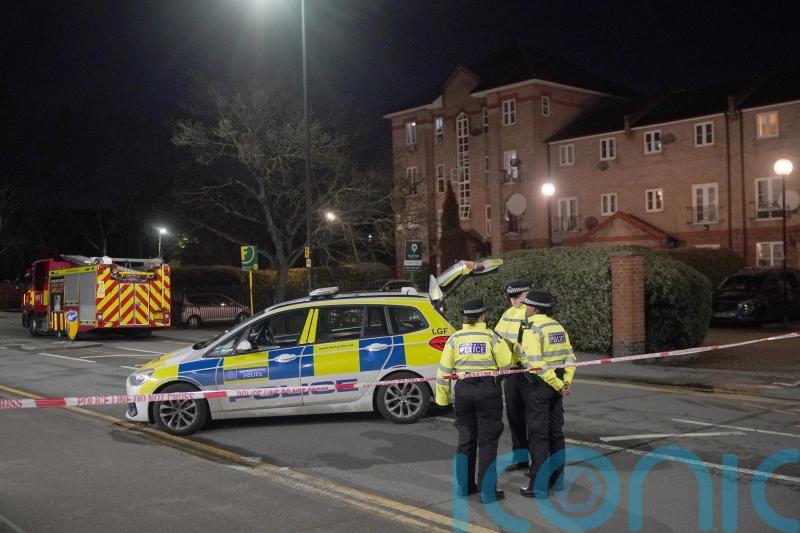 Man arrested on suspicion of murder after fire at flats in east London