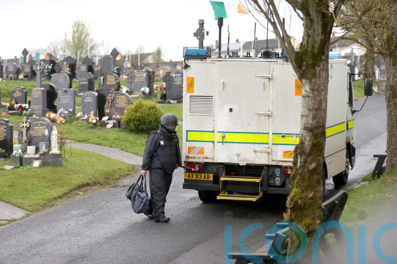 Four suspected pipe bombs found at cemetery following republican Easter event