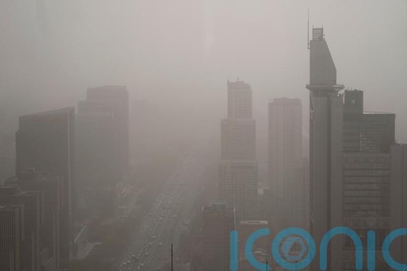 Northern China blanketed with floating sand and dust