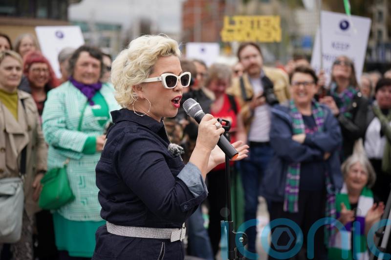 Police form line between rival transgender debate demos in Belfast