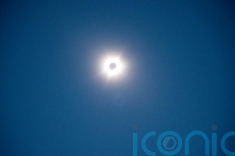 Thousands gather to enjoy spectacle of rare hybrid solar eclipse