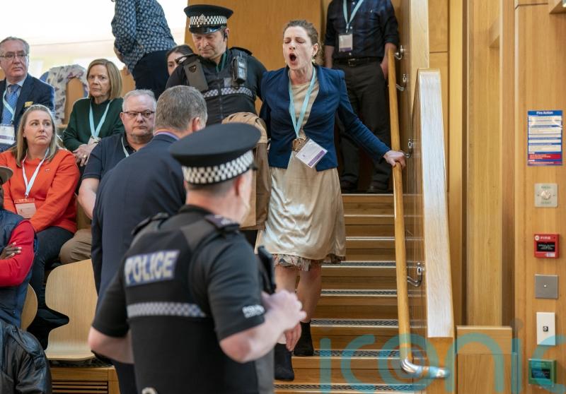 Climate campaigners stage protest in Holyrood chamber despite new restrictions