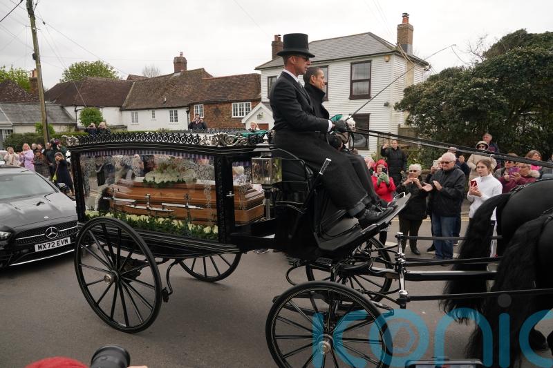 Coffin arrives at funeral of Paul O’Grady as hundreds line streets