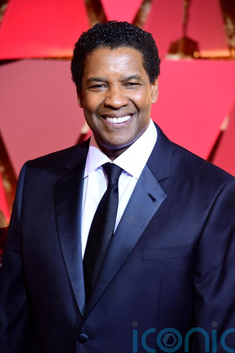 Denzel Washington accepts Lifetime Achievement award on CinemaCon opening night