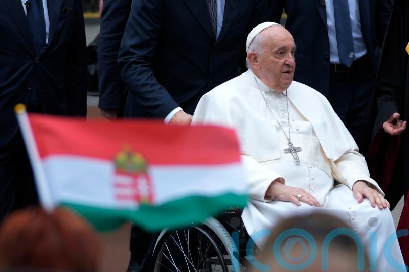 Pope urges Hungary to show charity to all as he visits refugees