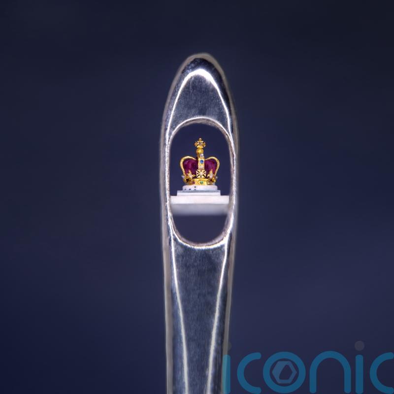 Sculptor creates tiny crown in the eye of a needle as coronation tribute