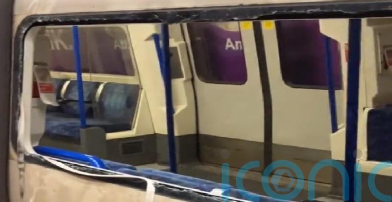 Passengers climb out of smashed windows at Tube station amid smoke emergency