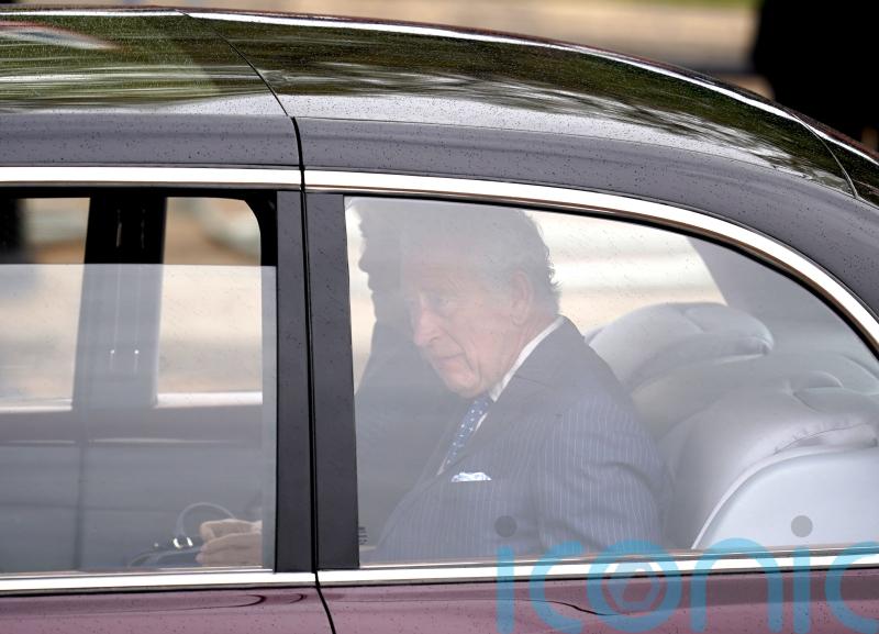 Charles and Camilla cheered by crowds in The Mall during first coronation appearance