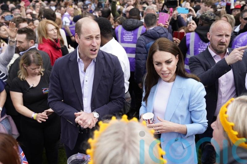 King and Queen give thanks as William and Kate greet well-wishers in Windsor