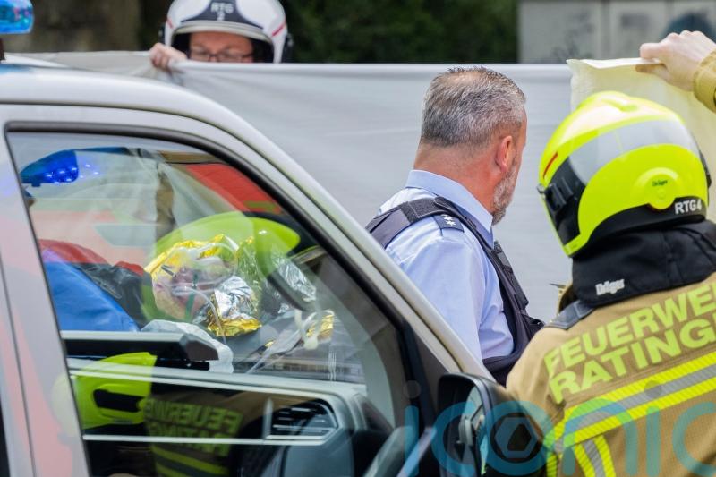 Man detained over blast which injured firefighters and police officers