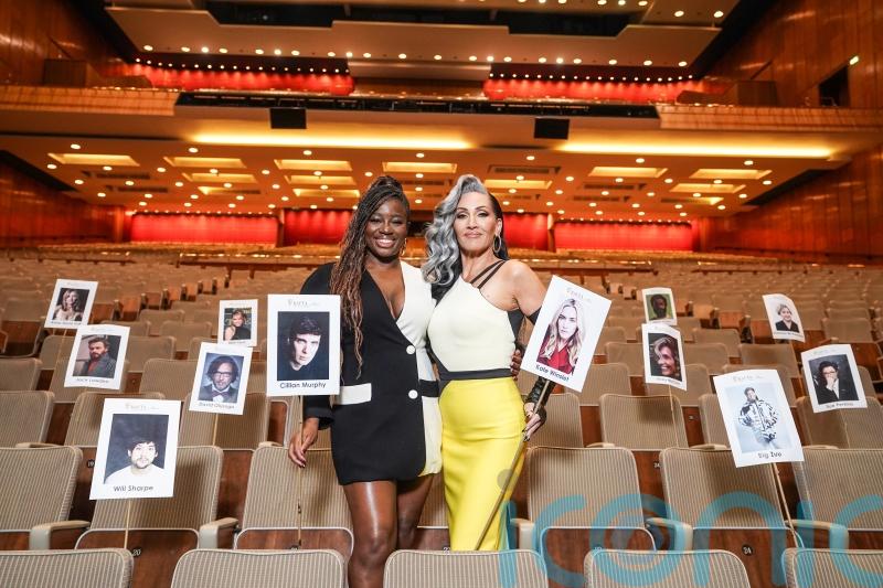 Clara Amfo and Michelle Visage pose with ‘heads on sticks’ photos for TV Baftas